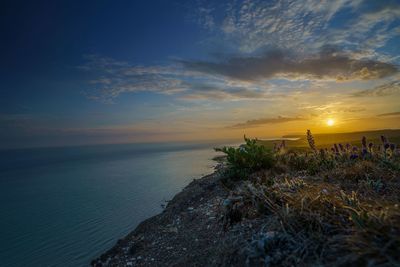 Scenic view of sea against sky during sunset