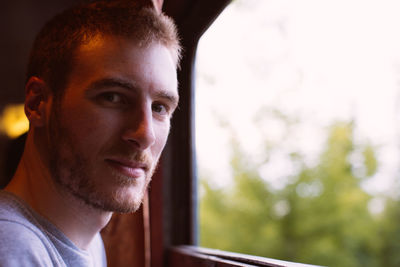 Close-up portrait of smiling young man