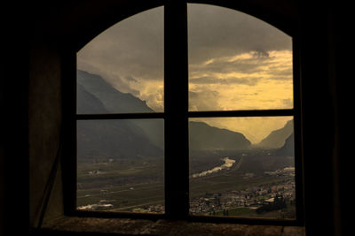 Scenic view of mountains seen through window