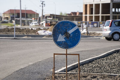 Close-up of traffic on road against buildings in city