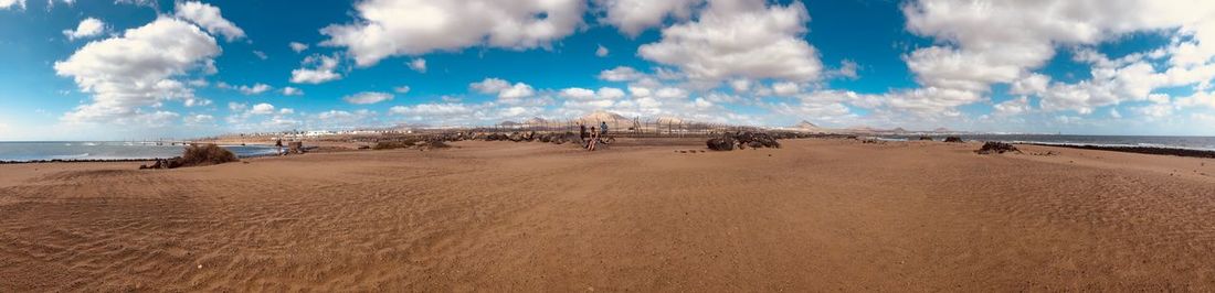 Panoramic view of desert against sky