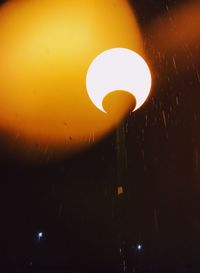 Low angle view of illuminated street light against sky at night