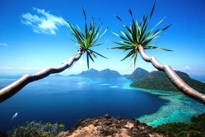 Scenic view of sea against blue sky