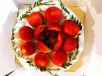 High angle view of strawberries in plate on table