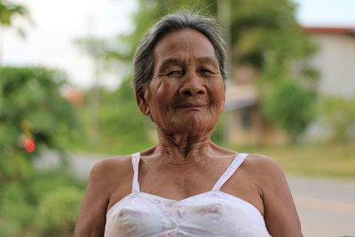 Portrait of woman against blurred background