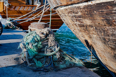Rope tied to fishing net on beach