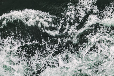 High angle view of water splashing in sea