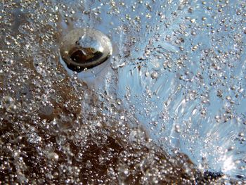 High angle view of drop on water