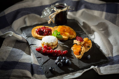 Close-up of dessert in plate on slate