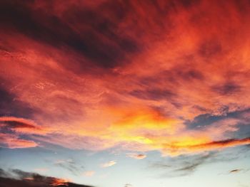 Low angle view of dramatic sky during sunset
