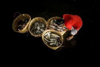 High angle view of man working on black background