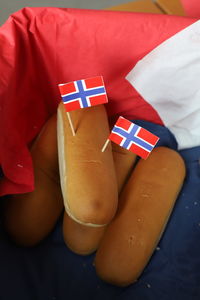 High angle view of breads with flags in container