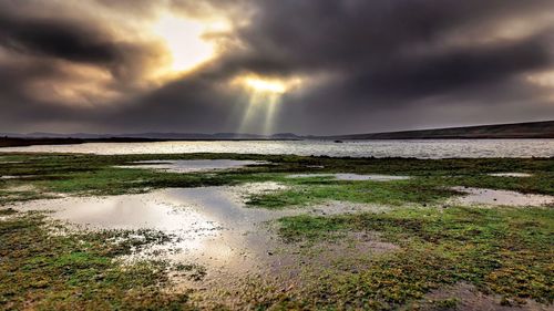 Scenic view of sea against sky during sunset