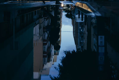 High angle view of street amidst buildings at night