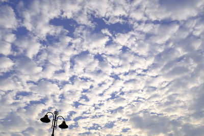 Low angle view of street light against sky