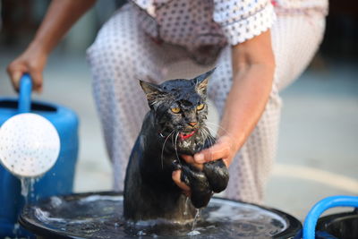 Midsection of man washing hands