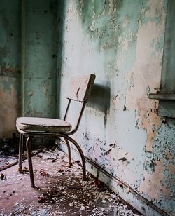 Damaged chairs in abandoned room