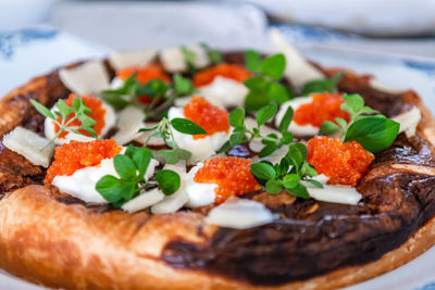 Close-up of pizza served in plate