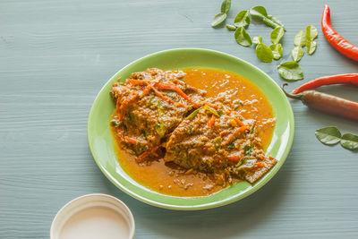 Thai food, fish curry on a plate placed on the table