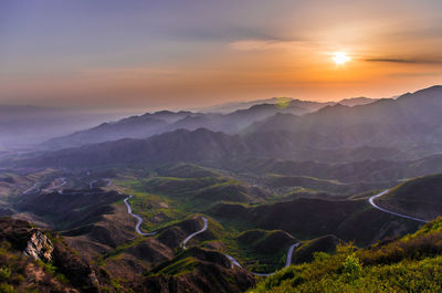 Scenic view of landscape against sky during sunset