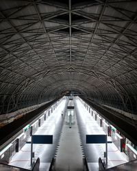 View of illuminated ceiling of empty railway station