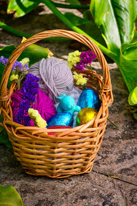 High angle view of multi colored eggs in basket