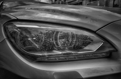 Close-up of car on road