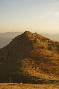 Scenic view of mountains against sky during sunset