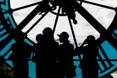 Low angle view of ferris wheel against sky