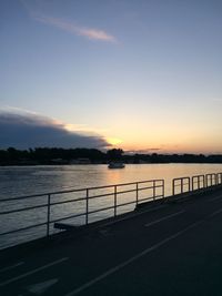 Scenic view of river at sunset