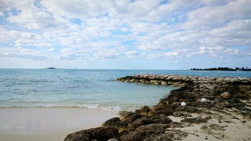 Scenic view of sea against cloudy sky