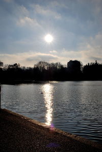 Scenic view of lake at sunset