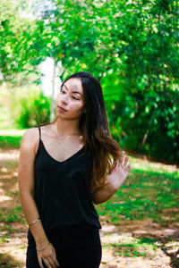 Young woman standing at park