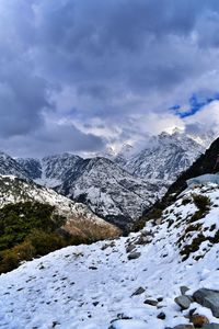 Scenic view of snowcapped mountains against sky