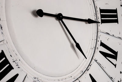 Close-up of clock on airplane window