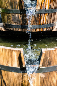 Close-up of water splashing on wood