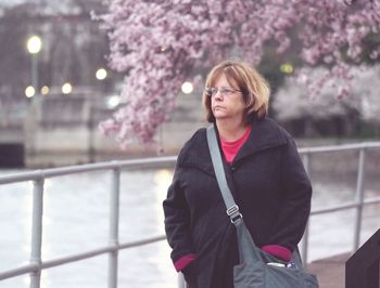 Portrait of young woman standing outdoors