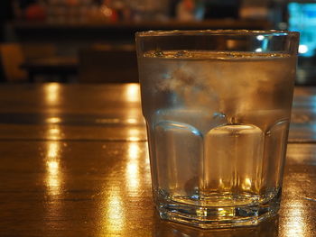 Close-up of beer glass on table