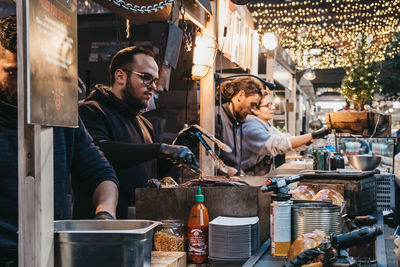 Men working at market stall