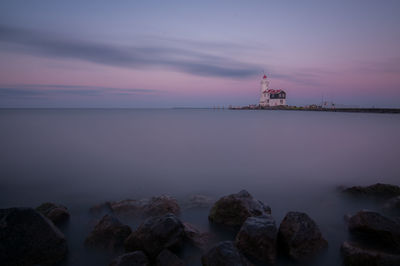 Scenic view of sea against sky at sunset