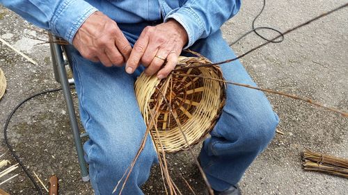 High angle view of making a basket