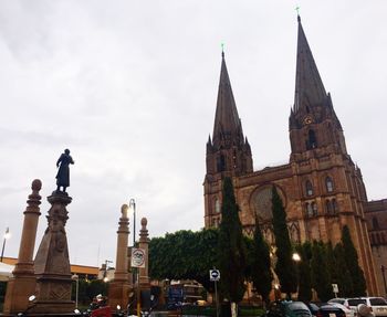 Statue of cathedral against sky