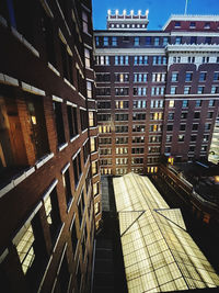 Street amidst buildings in city against sky