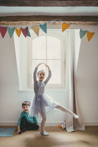 Girl and boy playing at home