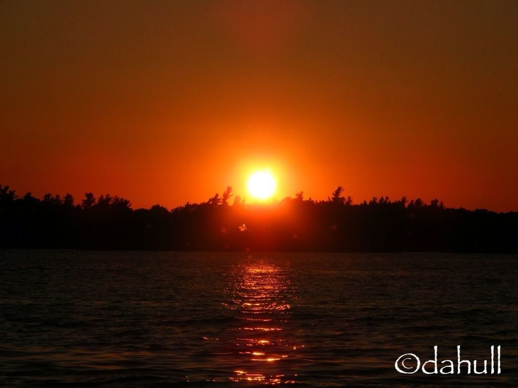 sunset, water, waterfront, scenics, tranquil scene, sun, orange color, beauty in nature, tranquility, rippled, silhouette, nature, lake, idyllic, sea, sky, reflection, river, sunlight, tree