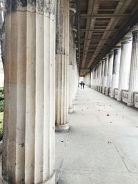 Rear view of man walking in corridor