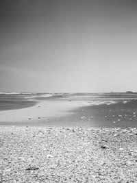 Scenic view of beach against clear sky