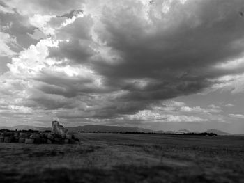 Scenic view of landscape against cloudy sky