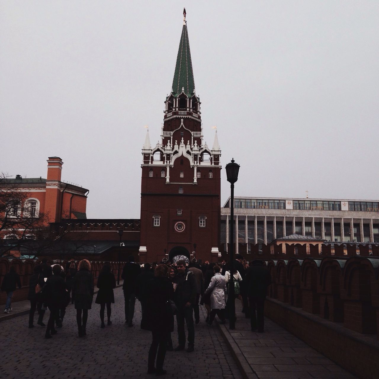 architecture, building exterior, built structure, large group of people, religion, place of worship, spirituality, famous place, travel destinations, person, church, men, city, tourism, clear sky, walking, travel, international landmark