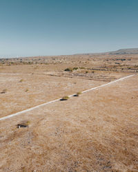 Scenic view of desert against clear sky